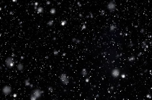 Detailed Snowfall Overlay Image Isolated on Black Background Perfect for Dynamic Visual Effects photo