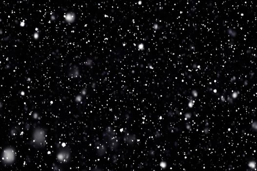 Detailed Snowfall Overlay Image Isolated on Black Background Perfect for Dynamic Visual Effects photo