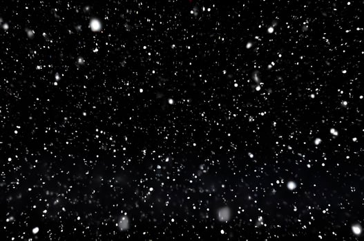 Detailed Snowfall Overlay Image Isolated on Black Background Perfect for Dynamic Visual Effects photo