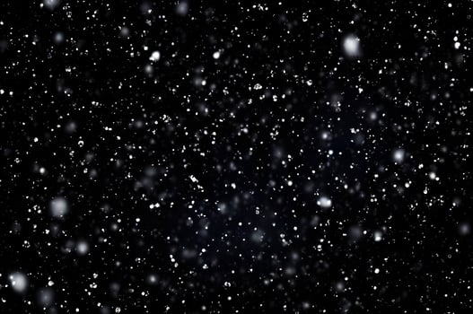Detailed Snowfall Overlay Image Isolated on Black Background Perfect for Dynamic Visual Effects photo