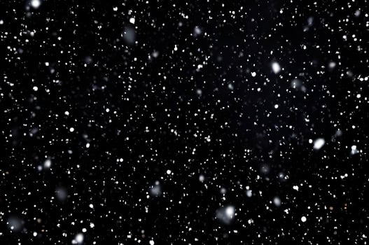 Detailed Snowfall Overlay Image Isolated on Black Background Perfect for Dynamic Visual Effects photo