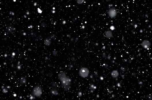 Detailed Snowfall Overlay Image Isolated on Black Background Perfect for Dynamic Visual Effects photo