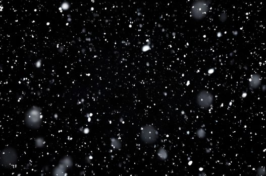 Detailed Snowfall Overlay Image Isolated on Black Background Perfect for Dynamic Visual Effects photo