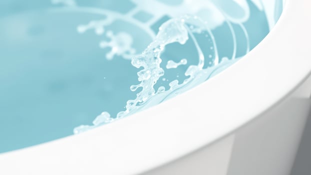 Splash of water in a white sink photo