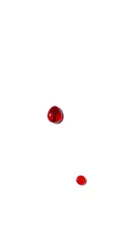 Two red drops on a white background photo
