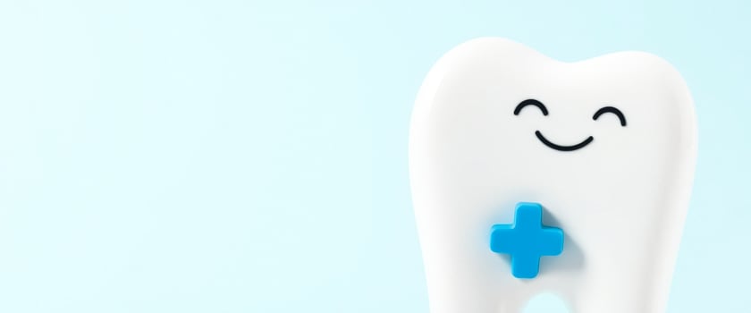 Happy Tooth with a Blue Plus Sign on a Light Blue Background photo