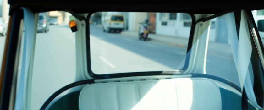 Interior view of a vintage vehicle driving down a street photo