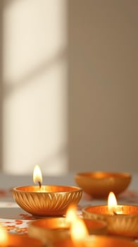 Golden Diya Candles on a Floral Tablecloth photo