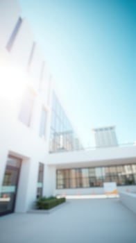 Blurred View of Modern Building with Blue Sky photo