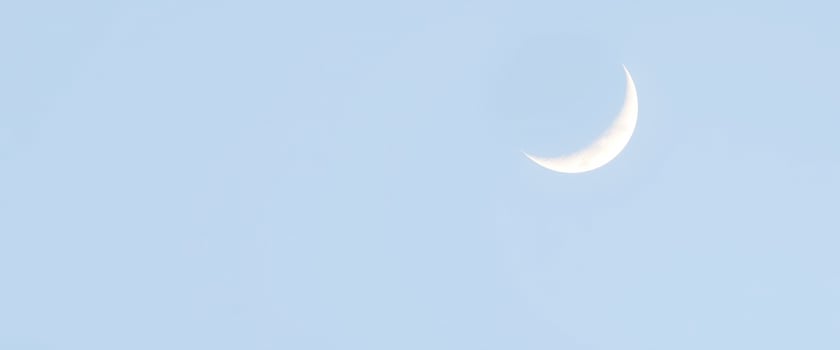 Crescent Moon in a Pale Blue Sky photo