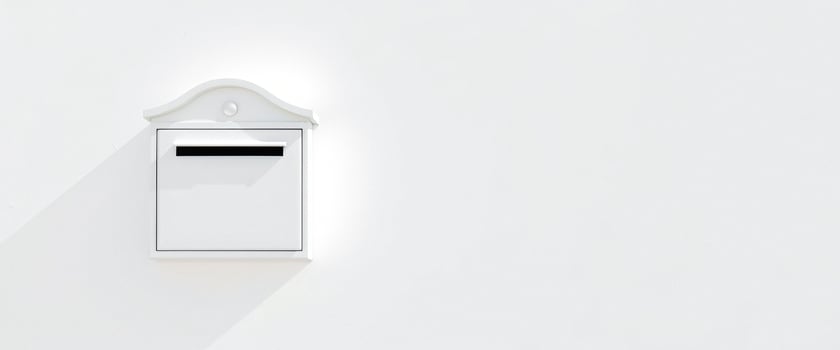 White Mailbox on a White Wall photo