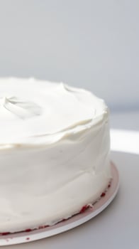 Closeup of a White Cake with Creamy Frosting photo