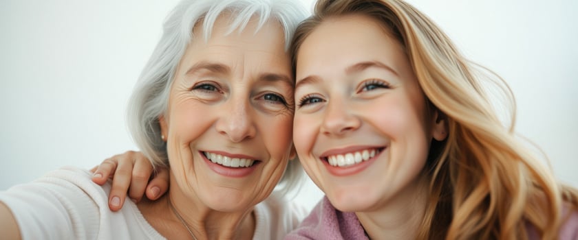 Happy grandmother and granddaughter smiling together photo