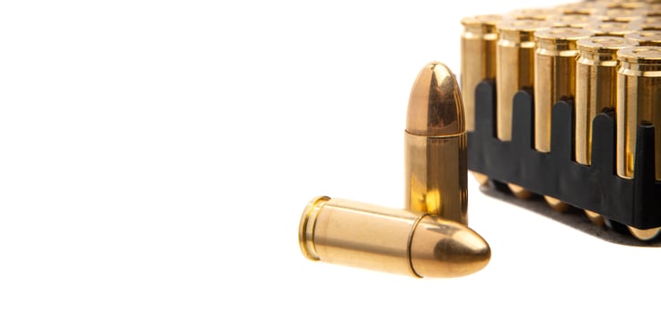 A box of cartridges for a pistol. Ammunition for weapons. Isolate on a white back. photo