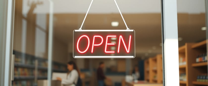 Open Sign Hanging on Glass Door photo