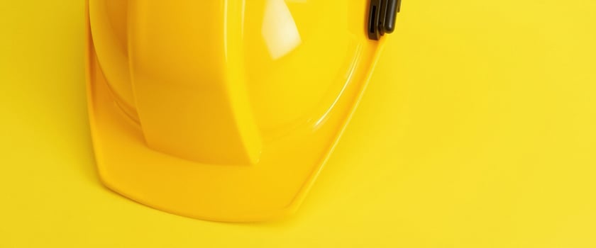Yellow Hard Hat on a Yellow Background photo