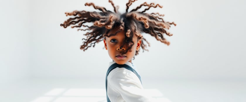 Young Boy with Dreadlocks Looking at the Camera photo