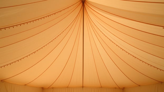 Tent ceiling with decorative orange trim photo