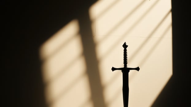 Sword Silhouette in Sunlight photo