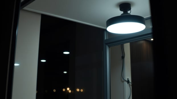 Modern Ceiling Light in a Dark Room photo