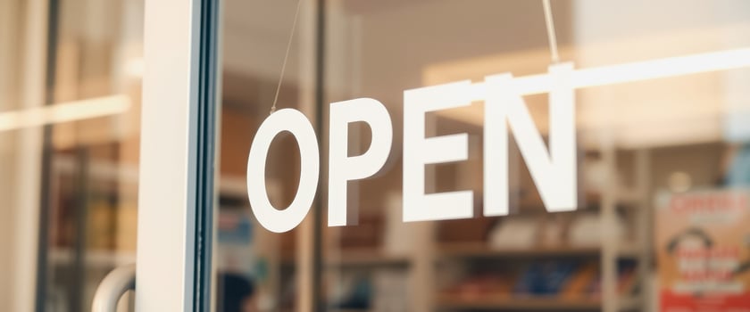 Open Sign Hanging on Glass Door photo