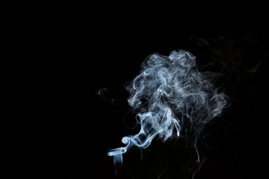 Smoke from flames or fog clouds graphic design art isolated on dark black background. photo