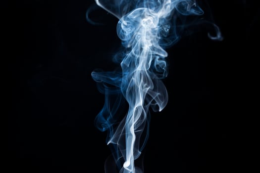 Smoke from flames or fog clouds graphic design art isolated on dark black background. photo