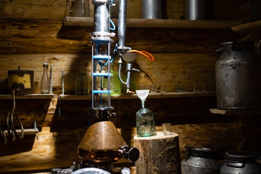Interior of very old wine cellar with vintage wine pump and dried meat delicatessen. photo