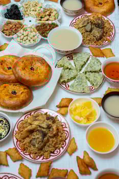 Meal with traditional Kyrgyz dishes served in the yurt. Local food in Kyrgyzstan. photo