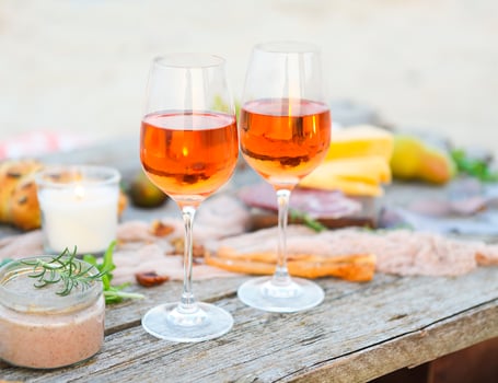 Beach picnic table with rose wine photo