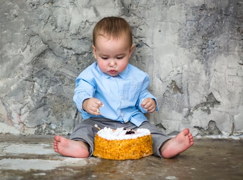 Adorable baby smashing cake photo