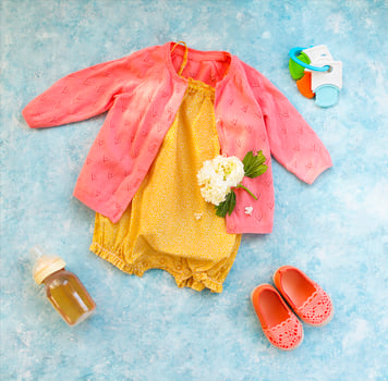Small child accessories on turquoise background photo