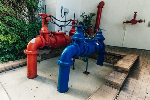 Red and blue iron pipe in the water treatment area. photo