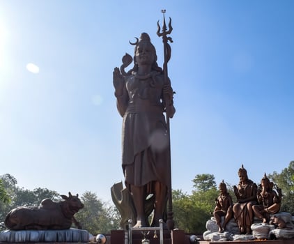 Big statue of Lord Shiv near Delhi International airport, Delhi, India, Lord Shiv big statue touching sky at main highway Mahipalpur, Delhi photo