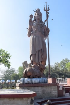 Big statue of Lord Shiv near Delhi International airport, Delhi, India, Lord Shiv big statue touching sky at main highway Mahipalpur, Delhi photo