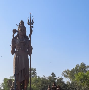Big statue of Lord Shiv near Delhi International airport, Delhi, India, Lord Shiv big statue touching sky at main highway Mahipalpur, Delhi photo