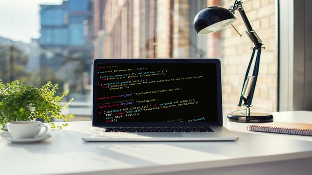 Coding script text on screen code in bracket software. photo
