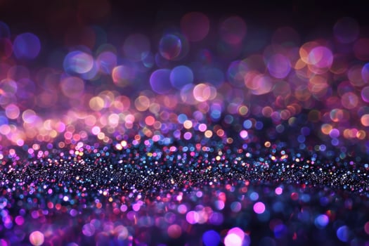 Colorful bokeh lights create a shimmering background with purple and gold tones photo