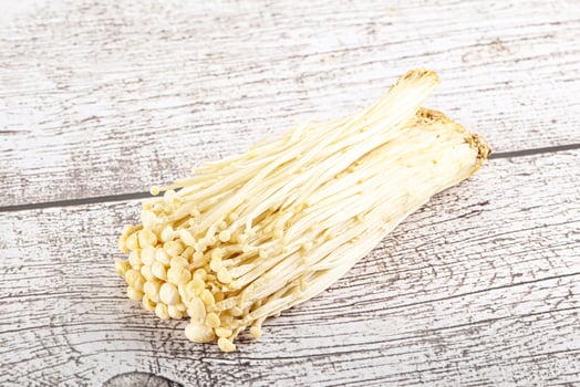 Tasty raw enoki mushroom heap photo