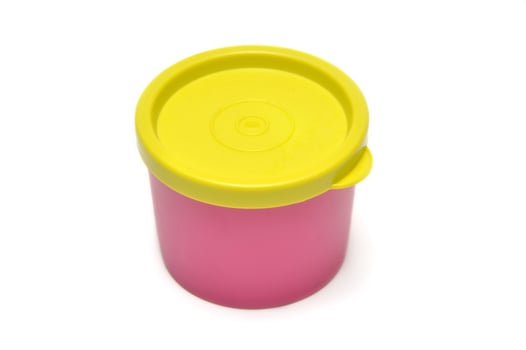 Pink tube plastic container with yellow lid white background photo