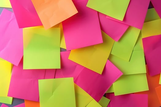 Colorful sticky notes scattered on a desk in a creative workspace photo