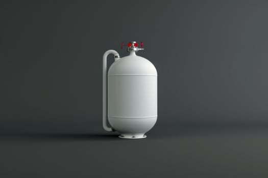 White gas cylinder with a valve and handle isolated against a dark background photo