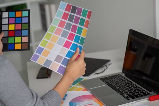 Graphic designer reviewing color palette for creative project photo