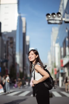 Urban chic, Trendy young lady in Tokyo, radiating positivity and success, showcasing dynamic lifestyle of modern Japanese women. photo