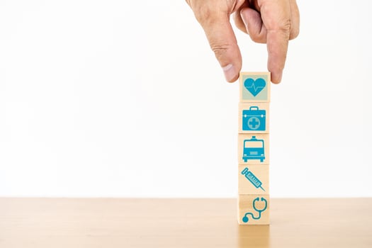Hand arranging wood block stacking with the medical icon for healthcare and Health insurance management concept photo