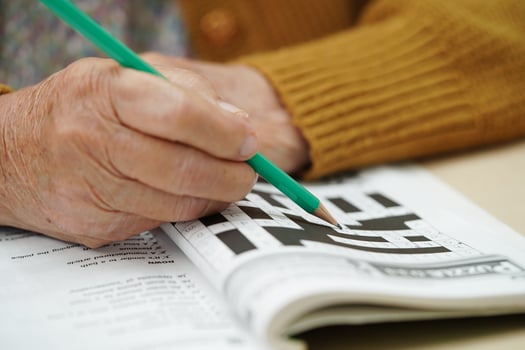 Bangkok, Thailand - May 15, 2022 elderly woman playing sudoku puzzle game. photo