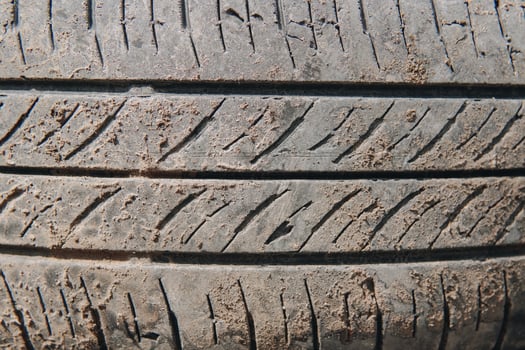 A tire with a lot of dirt on it photo