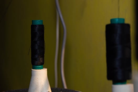 shot on black sewing thread. sewing thread installed in the machine. photo