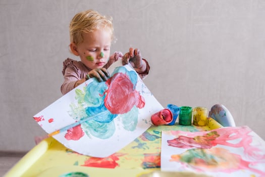 Female toddler drawing at table photo