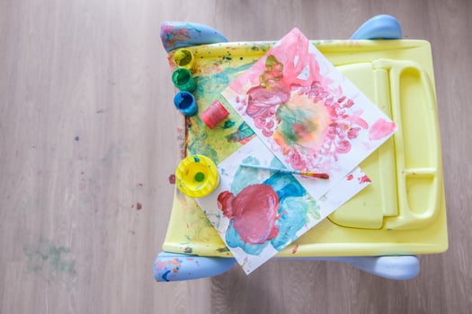 Female toddler drawing at table photo